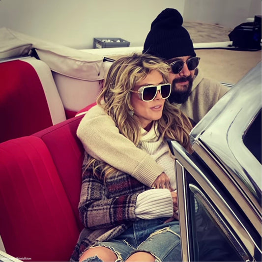 German-American model, television host and entrepreneur Heidi Klum is wearing the SENTALER Plaid Long Notched Collar Wrap Coat in Sand Plaid in a car in Greece.