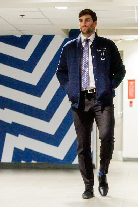 Toronto Maple Leafs Captain John Tavares is wearing the SENTALER x John Tavares Varsity Jacket in Deep Navy. 