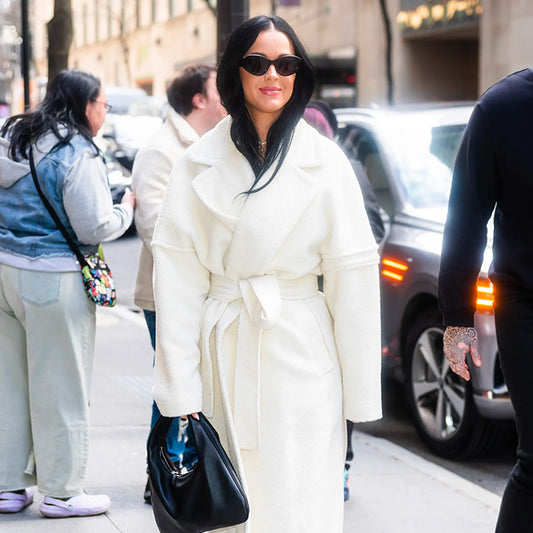 American singer, songwriter and television personality Katy Perry is wearing the SENTALER Men Technical Bouclé Alpaca Robe Coat in Ivory White walking in the streets of New York.