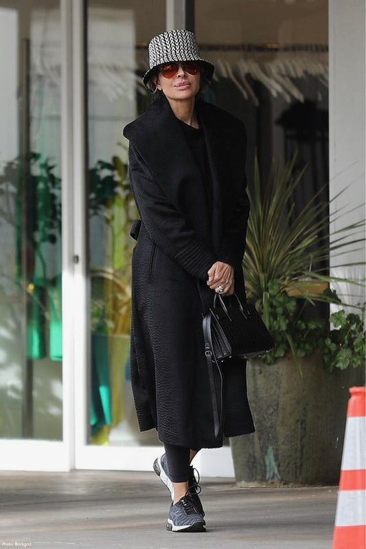 American actress, television personality and model Lisa Rinna is wearing the SENTALER Suri Alpaca Long Shawl Collar Wrap Coat in Black in the streets of Beverly Hills.