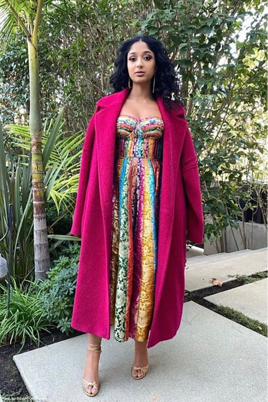 Canadian actress Maitreyi Ramakrishnan is wearing the SENTALER Men Technical Bouclé Alpaca Robe Coat in Fuchsia outside on her way to the 19th Annual Unforgettable Gala in Beverly Hills.