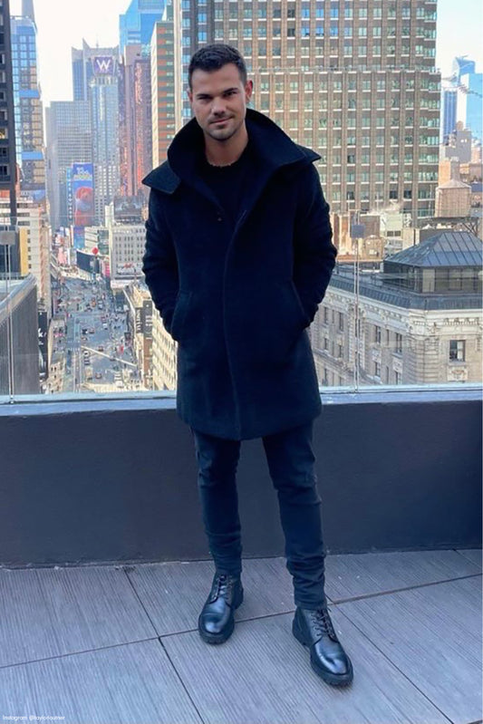 American actor Taylor Lautner is wearing the SENTALER Men Technical Bouclé Alpaca Double Collar Topcoat in Black on a rooftop in New York.