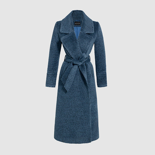 Image features the Elle logo and an off-figure image of the Sentaler Bouclé Alpaca Long Notched Collar Wrap Coat featured in Bouclé Alpaca and available in Lazuli Blue.