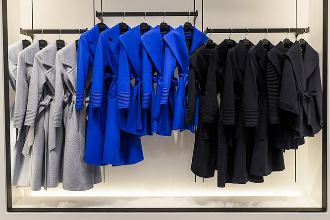 Image features the Fashion logo and an image of SENTALER wrap coats in Powder Blue, Cobalt Blue and Deep Navy on a rack at the SENTALER Flagship at 55 Avenue Road.