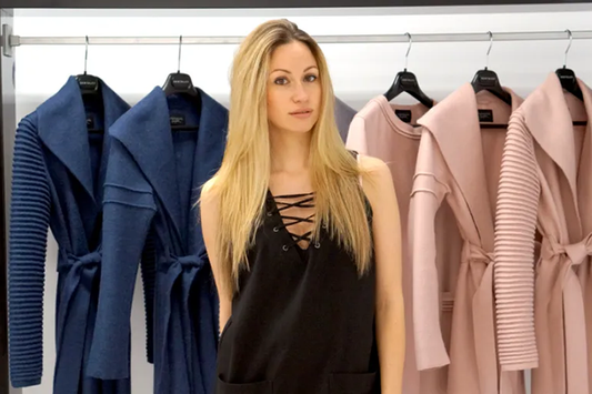 Image features the WWD logo and an image of designer, founder, president and creative director of SENTALER, Bojana Sentaler standing in front of a rack of SENTALER coats.