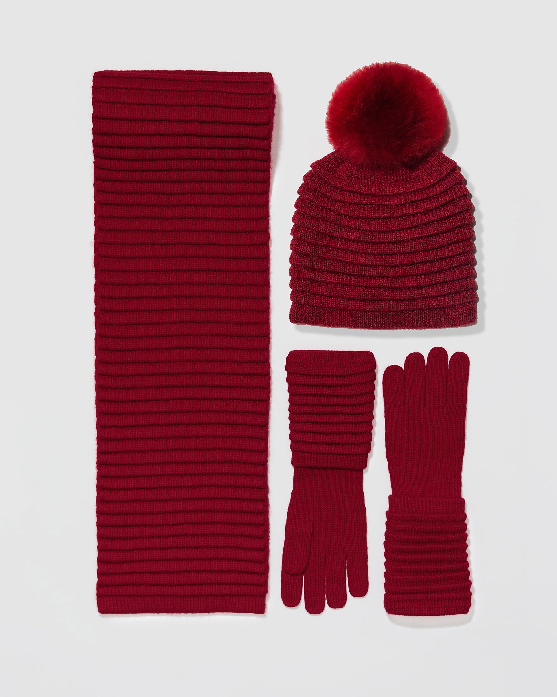 Sentaler women’s garnet red ribbed winter accessories set including hat, scarf, and gloves made of Baby Alpaca fabric, displayed on a white background.