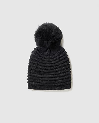 Sentaler Adult Ribbed Black Hat With Fur Pompon in Baby Alpaca yarn. Seen as off figure.