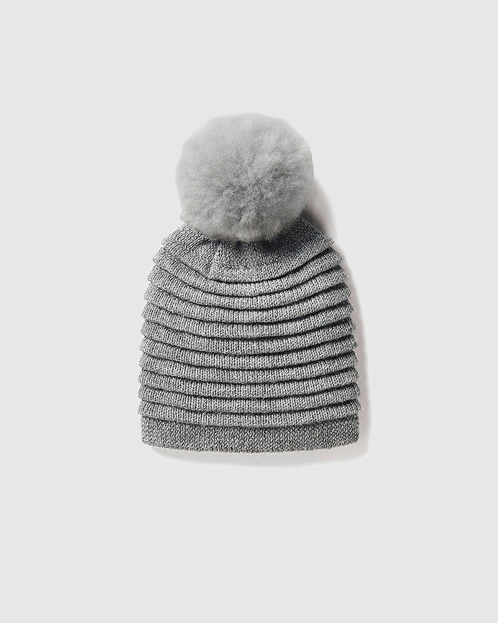 Sentaler Adult Ribbed Grey Hat With Fur Pompon in Baby Alpaca yarn. Seen as off figure.