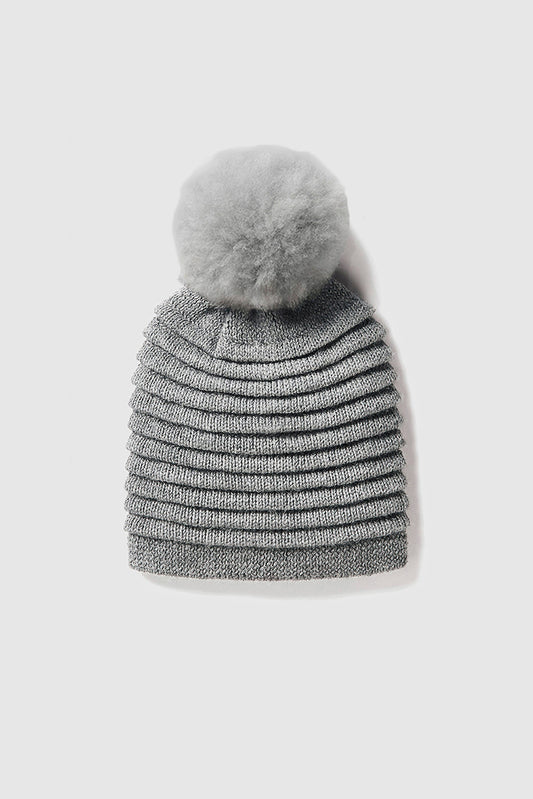 Sentaler Adult Ribbed Hat With Oversized Fur Pompon featured in Baby Alpaca and available in Grey. Seen as off figure.
