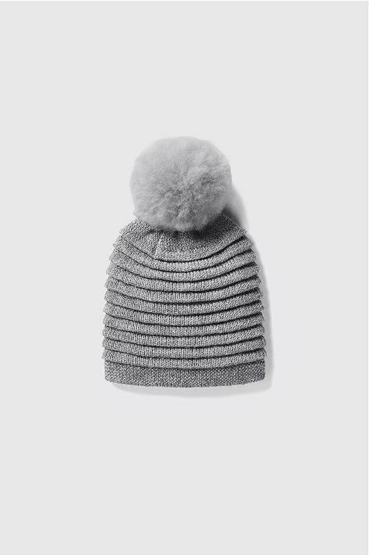 Sentaler Kids (6-14 Years) Ribbed Hat with Oversized Fur Pompon featured in Baby Alpaca and available in Grey. Seen as off figure.