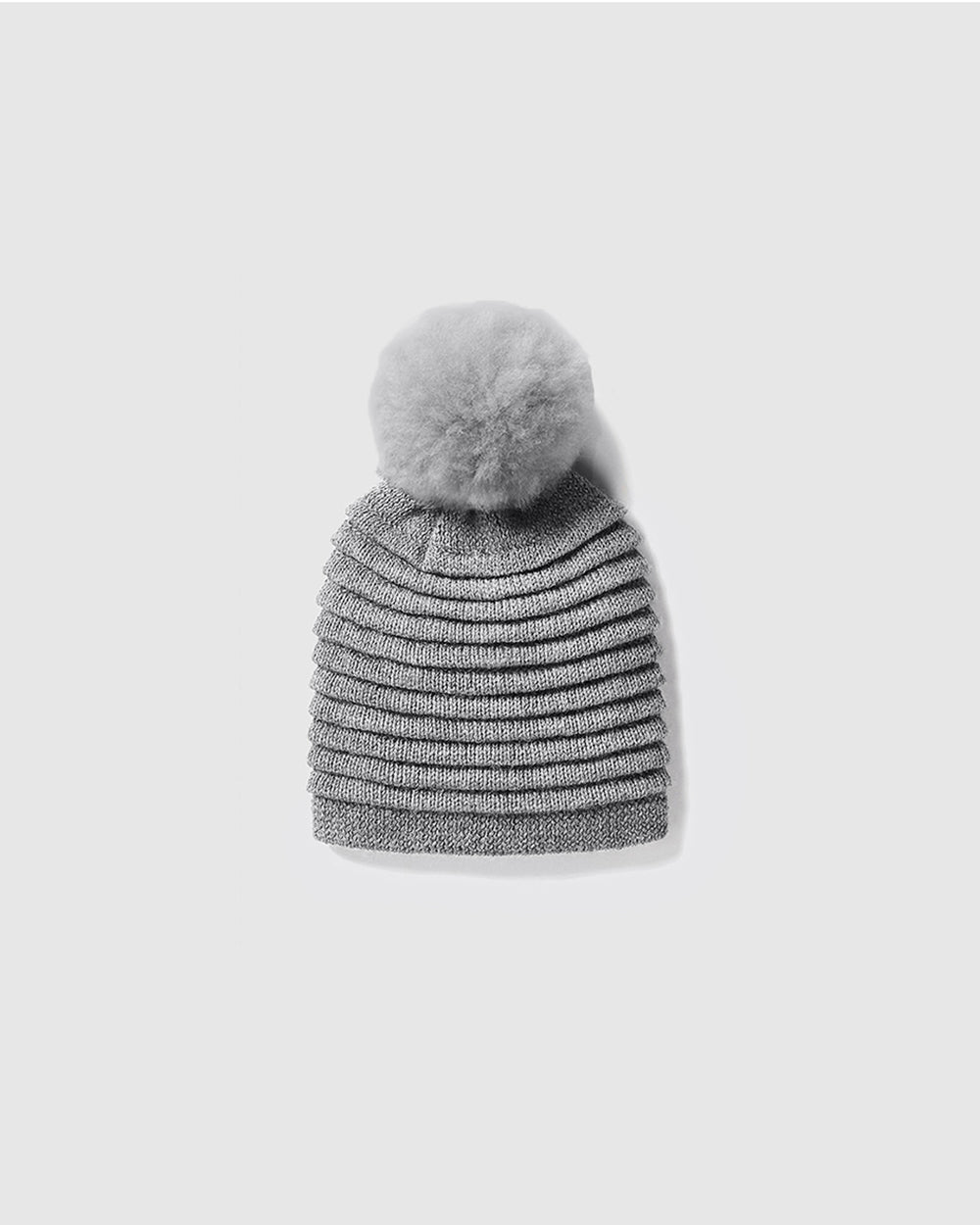 Sentaler Kids Ribbed Grey Hat with Fur Pompon (6-14 Years) in Baby Alpaca yarn. Seen as off figure.