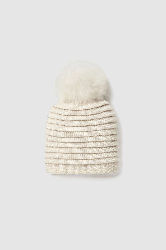 Sentaler Kids (6-14 Years) Ribbed Hat with Oversized Fur Pompon featured in Baby Alpaca and available in Ivory White. Seen as off figure.