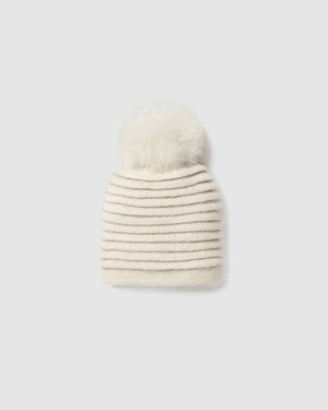 Sentaler kids (6-14 years) ribbed ivory winter hat made of Baby Alpaca fabric with oversized fur pompom, displayed on a white background.