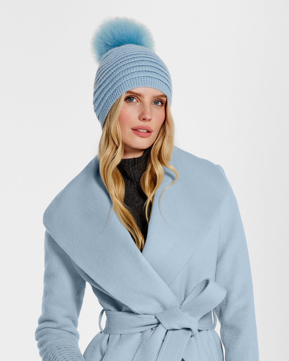 Sentaler Adult Ribbed Powder Blue Hat with Oversized Fur Pompon in Baby Alpaca wool. Seen from front close up on female model.