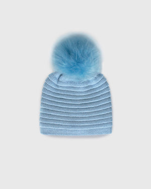 Sentaler women’s powder blue ribbed winter hat made of Baby Alpaca fabric with oversized fur pompom, displayed on a white background.