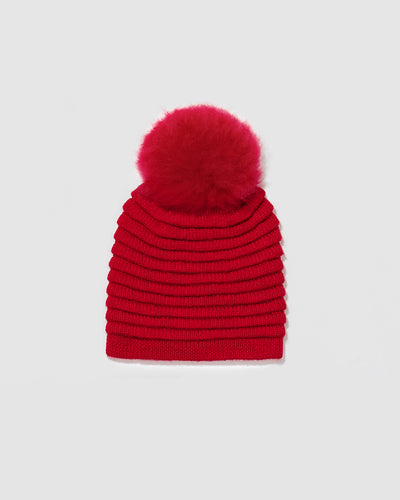 Sentaler Adult Ribbed Red Hat With Fur Pompon in Baby Alpaca yarn. Seen as off figure.