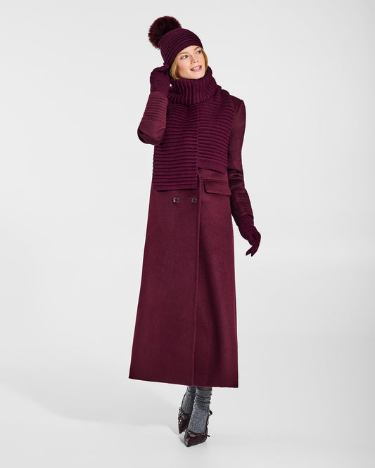 Front view of model wearing Sentaler's signature cherry lacquer ribbed hat, scarf, and gloves, paired with a matching cherry lacquer coat.