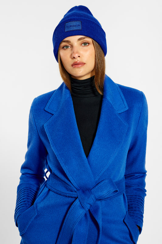 Sentaler Long Notched Collar Wrap Coat and Alpaca Beanie crafted in Baby Alpaca wool and in Cobalt Blue. Seen from front belted close up on female model.
