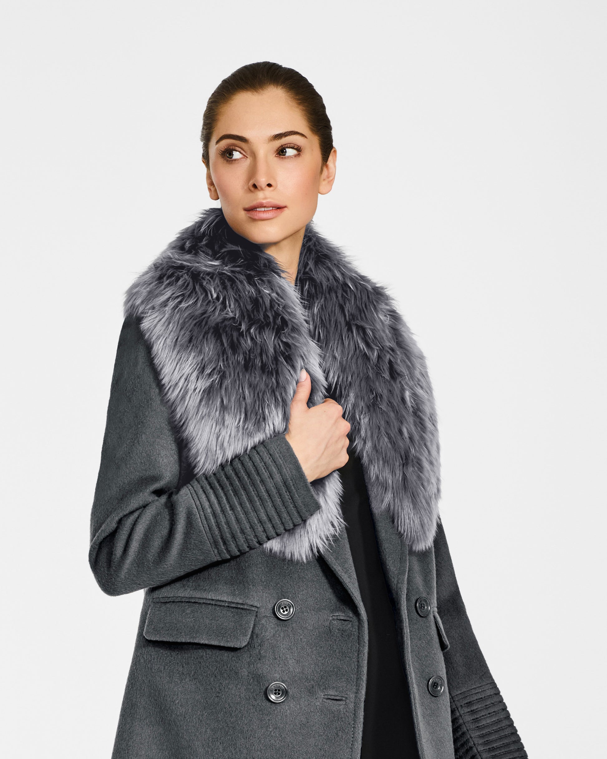 Side view of model wearing Sentaler's mid grey alpaca shearling shawl collar, paired with a mid grey coat.