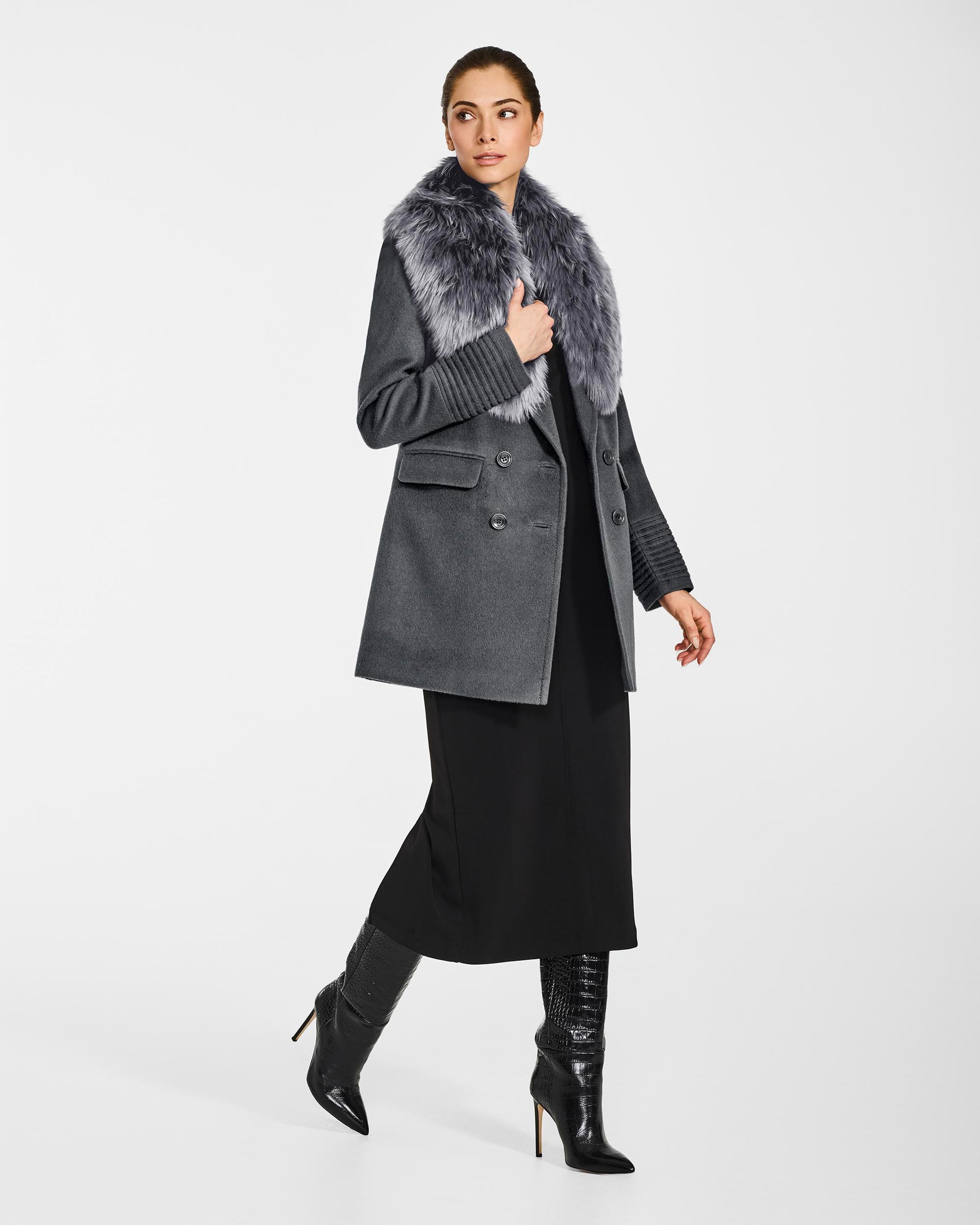 Side view of model wearing Sentaler's mid grey alpaca shearling shawl collar, paired with a mid grey coat.