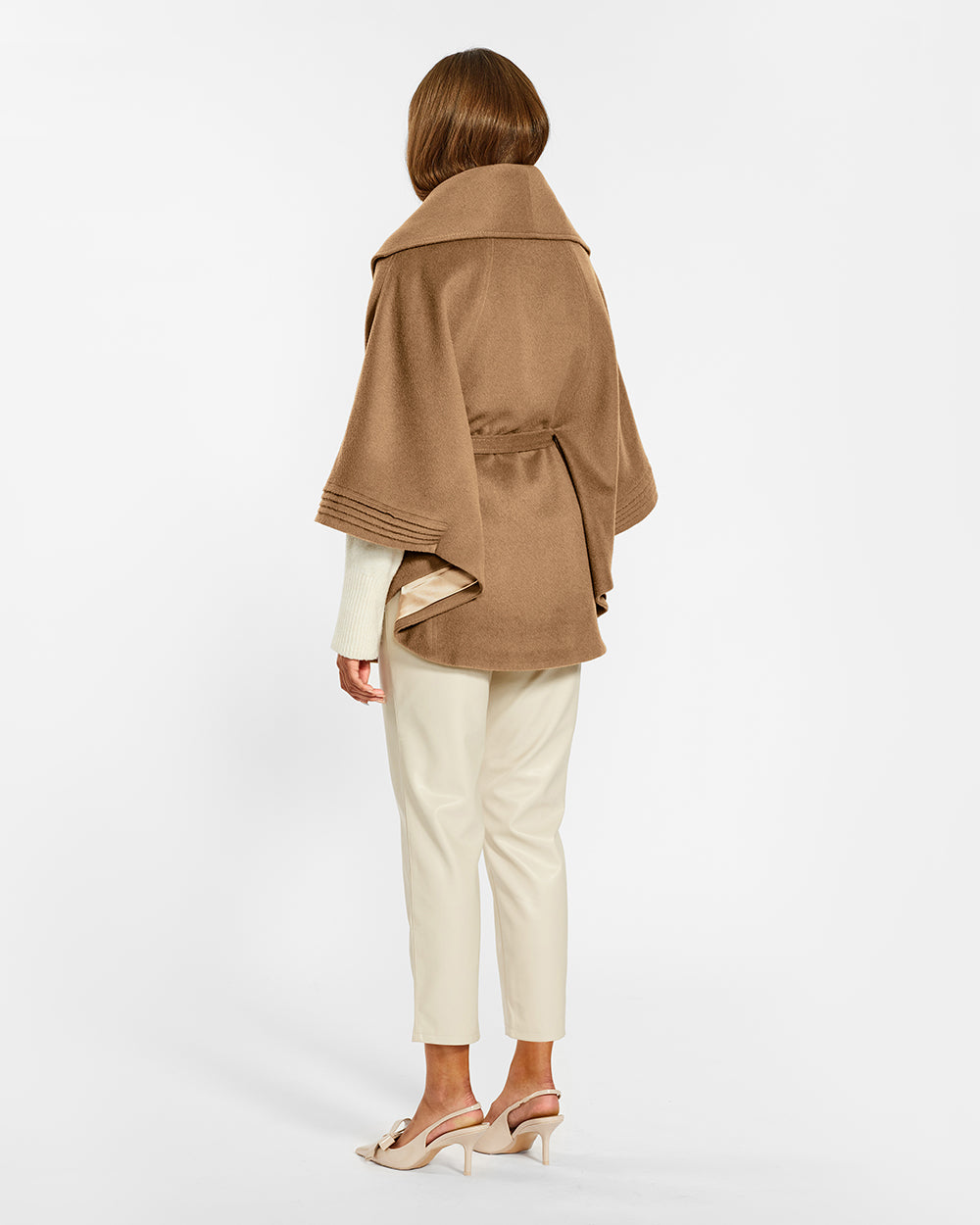 Sentaler Dark Camel Cape with Shawl Collar and Belt in Baby Alpaca wool. Seen from back belted on female model.