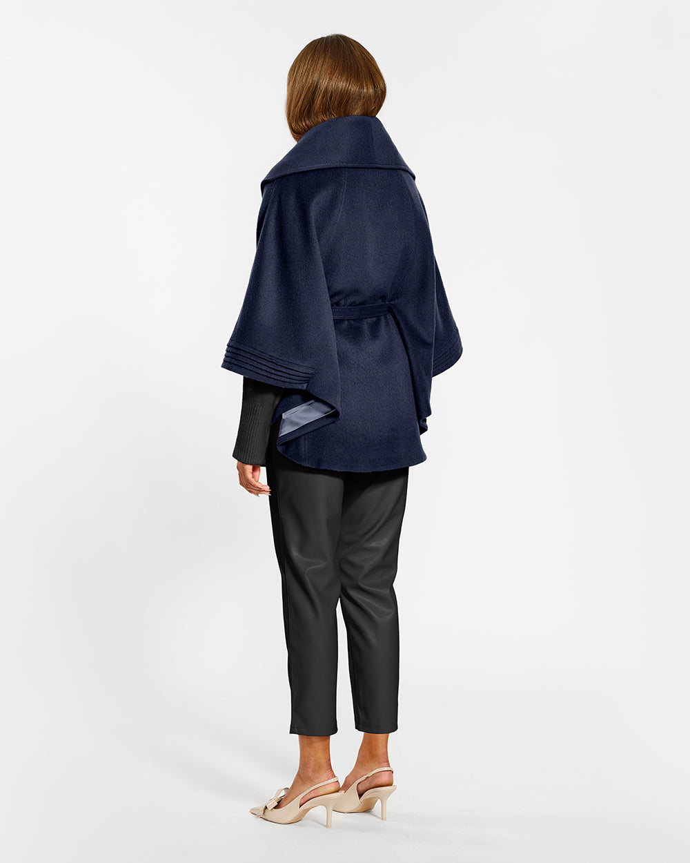 Sentaler Deep Navy Cape with Shawl Collar and Belt in Baby Alpaca wool. Seen from back belted on female model.