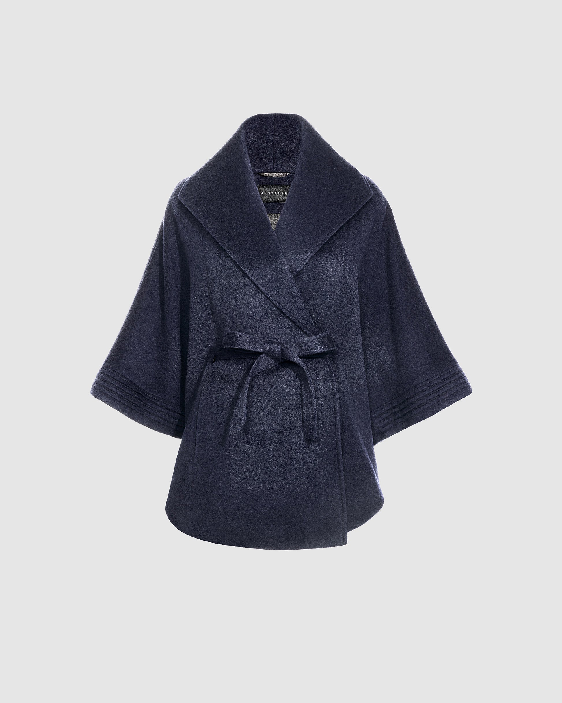Sentaler deep navy cape made of baby alpaca wool with a shawl collar, belted.