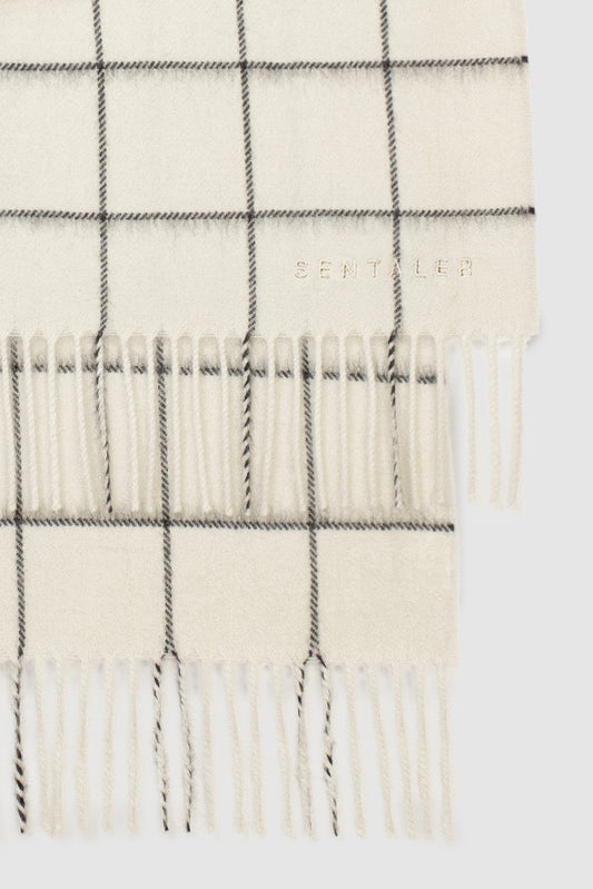 Sentaler Baby Alpaca Check Classic Scarf featured in Baby Alpaca and available in Ivory Check White. Seen as off figure close up.