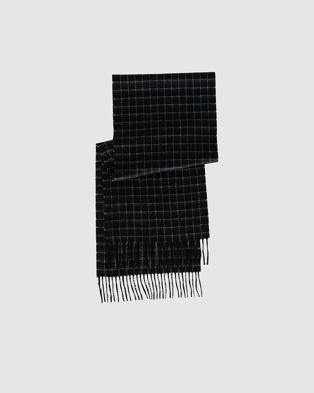 Sentaler Baby Alpaca Classic Black Check Scarf in Baby Alpaca wool. Seen as off figure.