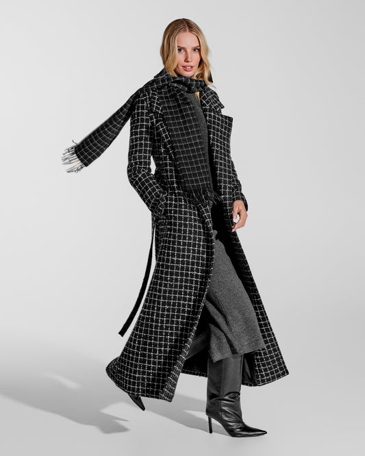 Side view of model wearing Sentaler's adult Black Check classic scarf, made of baby alpaca yarn. 