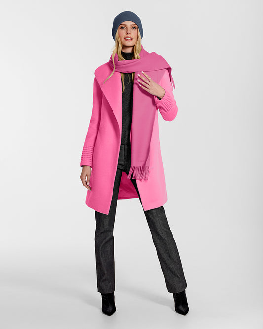 Front view of model wearing Sentaler's adult Cosmetic Pink classic scarf, made of baby alpaca yarn. 