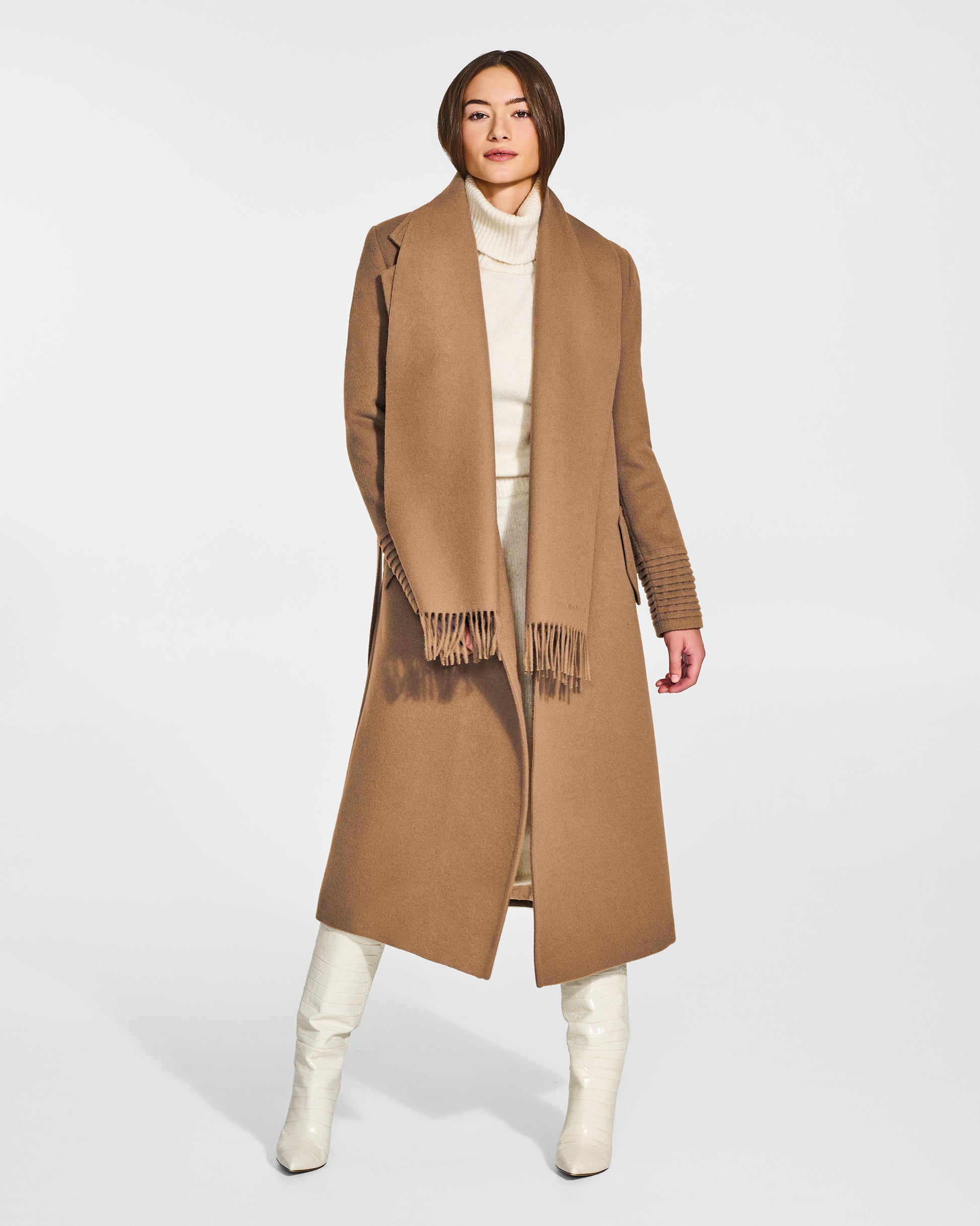 Front view of model wearing Sentaler's adult Dark Camel classic scarf, made of baby alpaca yarn. 