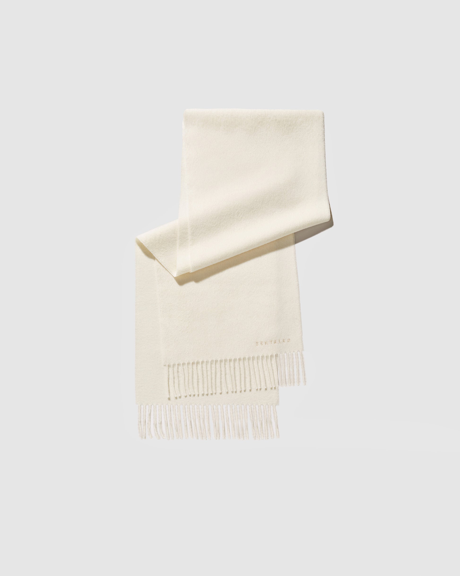 Sentaler Ivory Baby Alpaca Classic Scarf in Alpaca yarn displayed on a white background. 