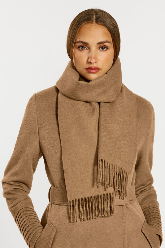 Sentaler Baby Alpaca Classic Scarf and the Long Notched Collar Wrap Coatcrafted in Baby Alpaca and in Dark Camel. Seen from front close up on female model.