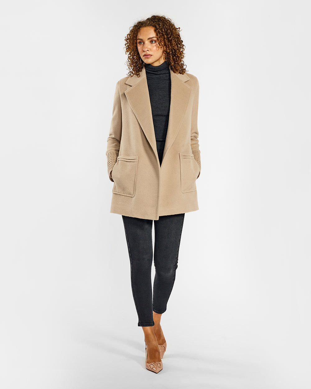 Sentaler Cropped Notched Collar Square Pocket Wrap Camel Coat in Baby Alpaca wool. Seen from front open on female model.