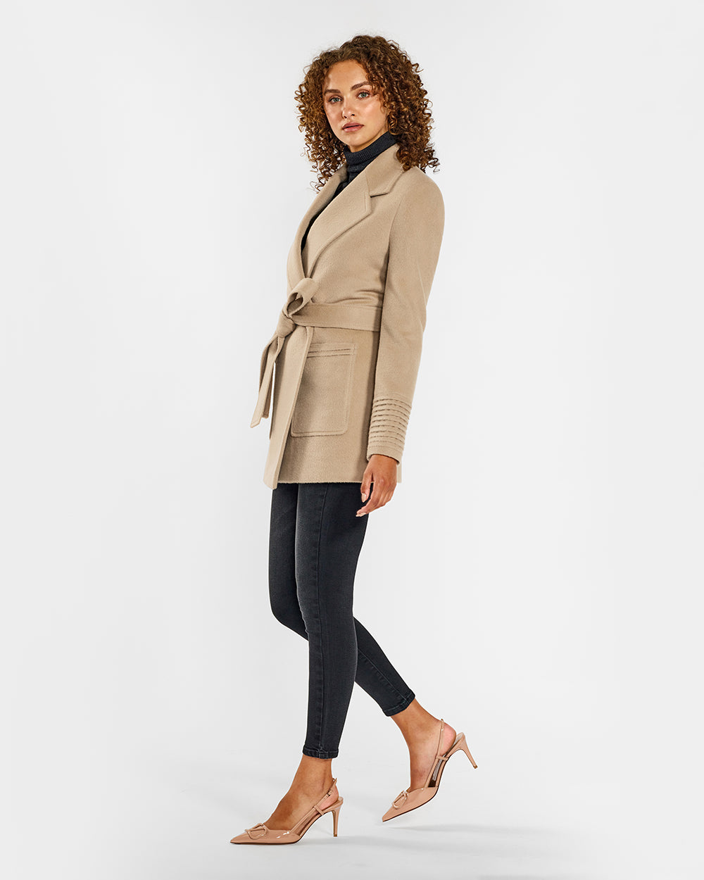 Sentaler Cropped Notched Collar Square Pocket Wrap Camel Coat in Baby Alpaca wool. Seen from side belted on female model.