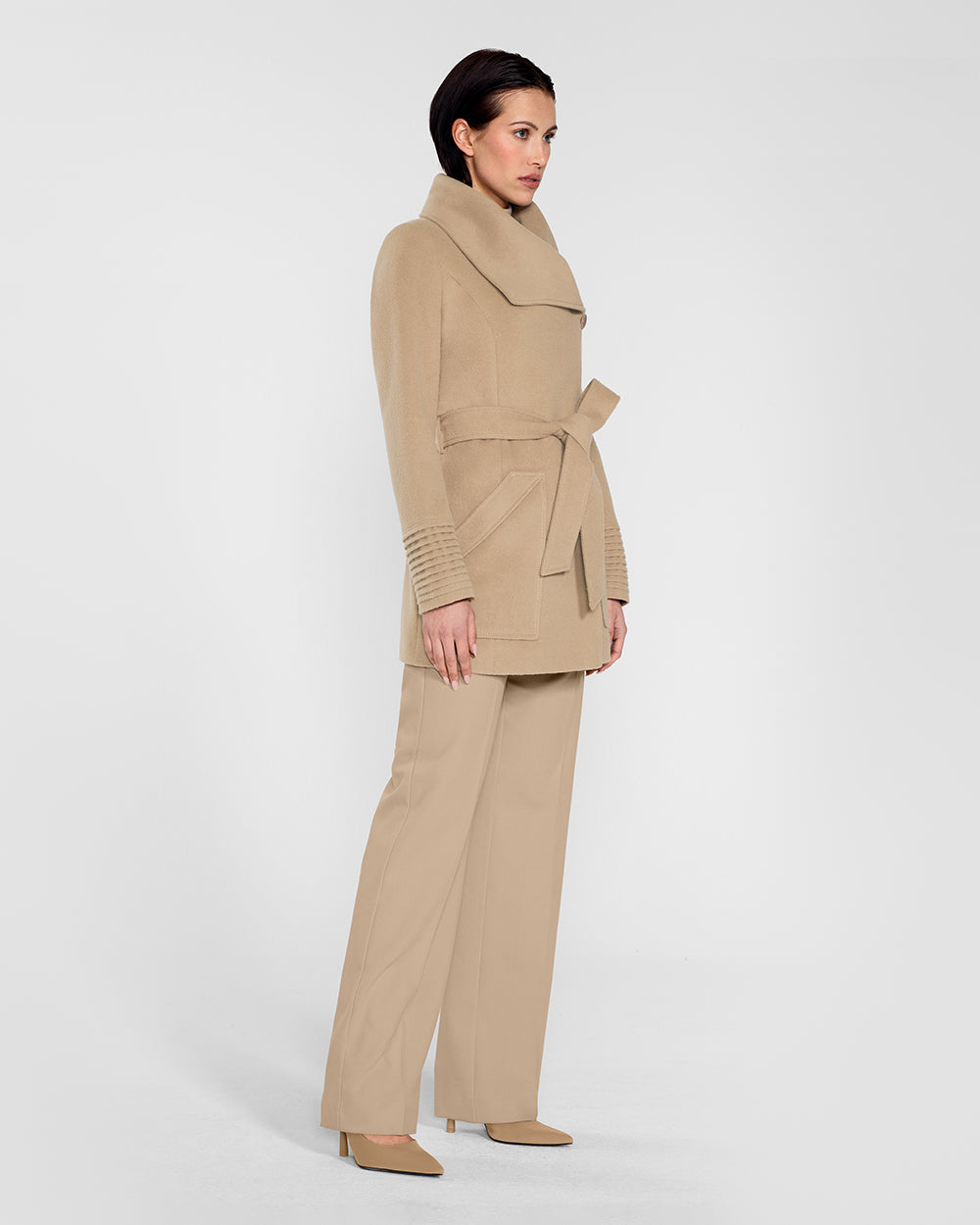 Sentaler Cropped Wide Collar Wrap Camel Coat in Baby Alpaca wool. Seen from side belted on female model.