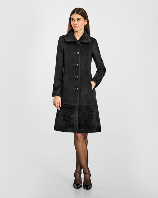 Sentaler A-line Black Coat with Bouclé Alpaca Collar and Trim in Baby Alpaca wool. Seen from front on female model.