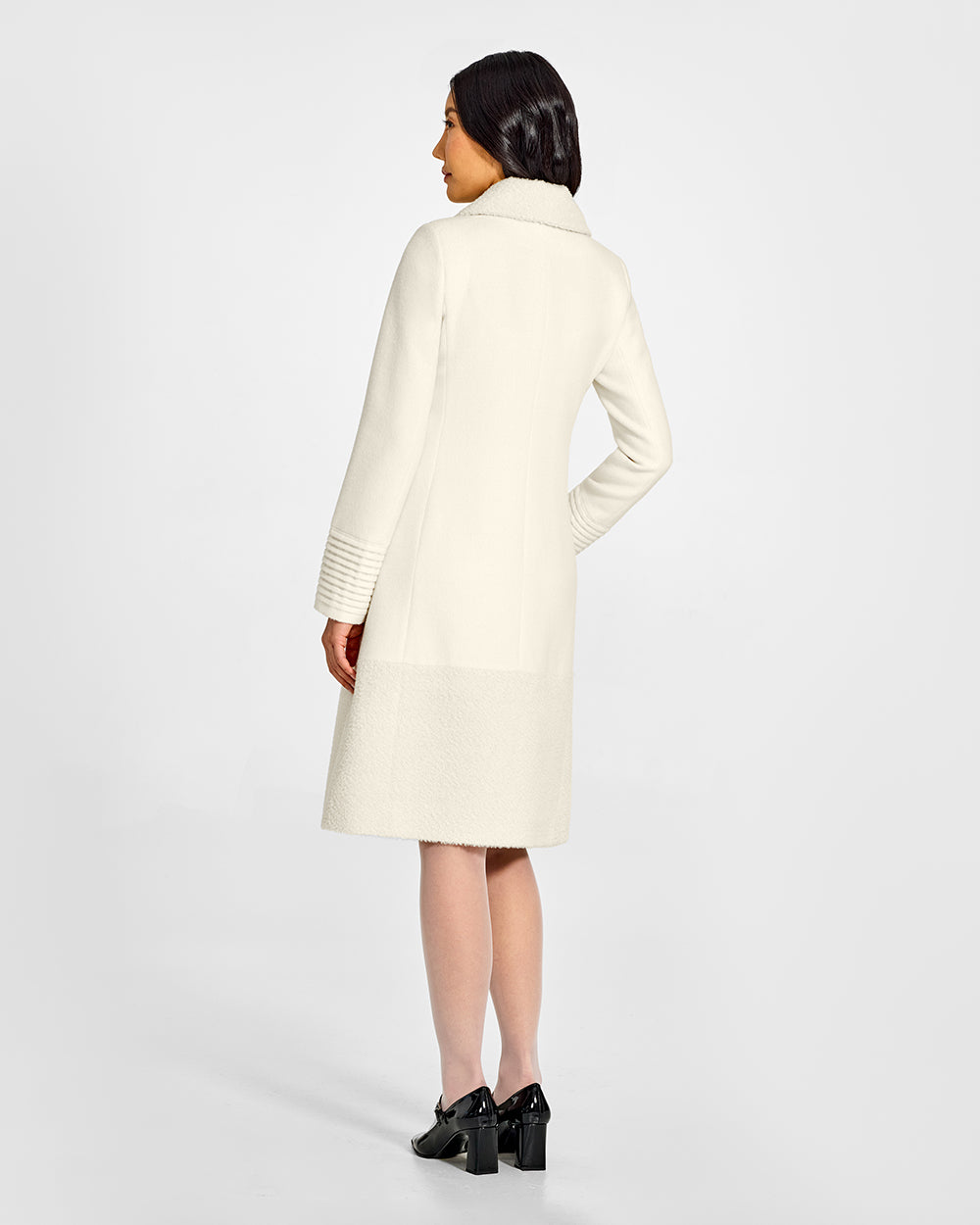 Sentaler A-line Ivory Coat with Bouclé Alpaca Collar and Trim in Baby Alpaca wool. Seen from back on female model.