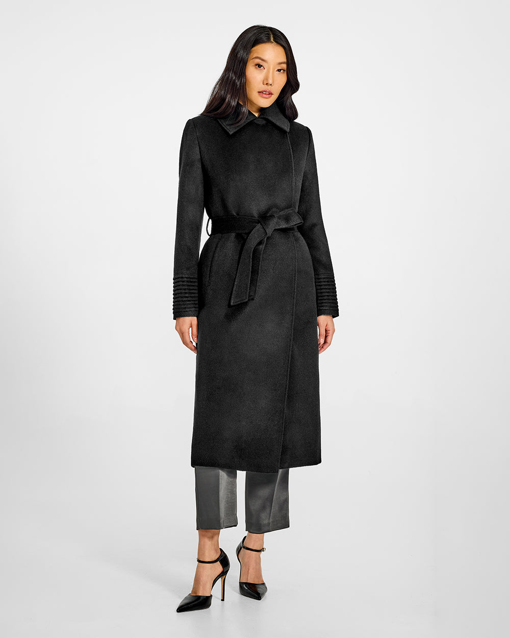 Sentaler Long Lapel Collar Wrap Black Coat in Baby Alpaca wool. Seen from front belted on female model.