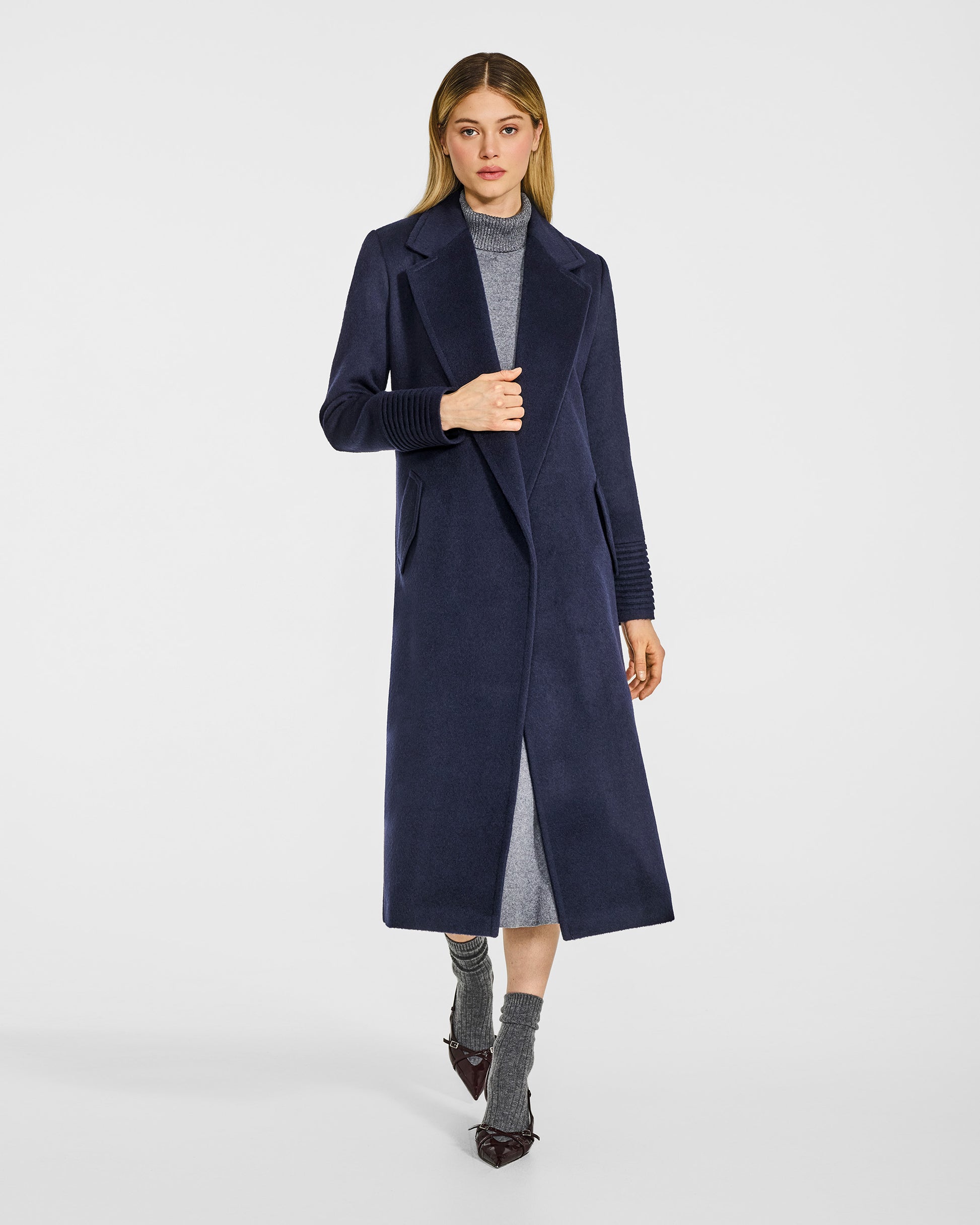 Front view of model in Sentaler long deep navy wrap coat with notched collar in baby alpaca wool, open.