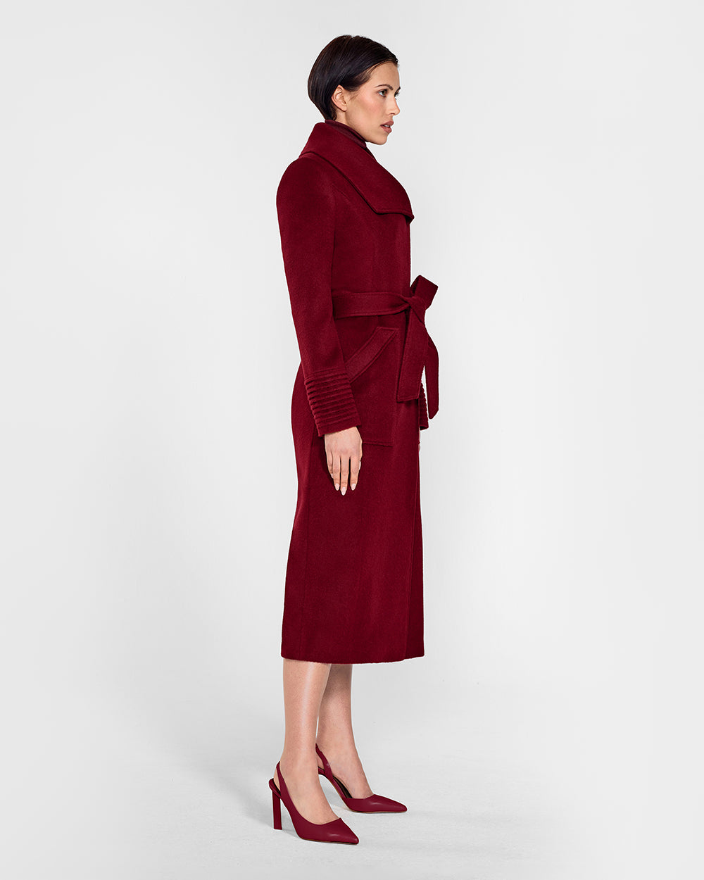 Sentaler Long Wide Collar Wrap Garnet Red Coat in Baby Alpaca wool. Seen from side belted on female model.