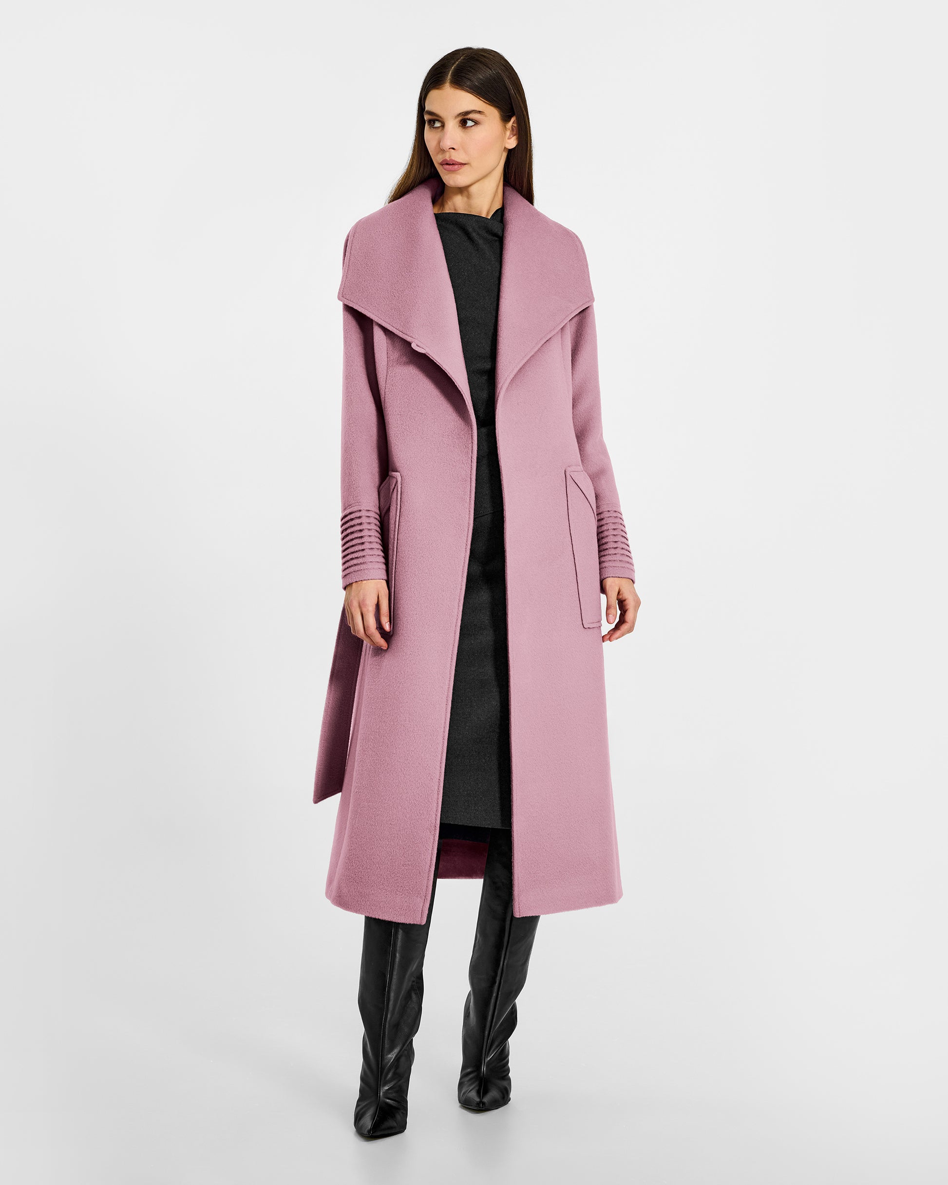 Front view of model wearing a Sentaler peony pink long wrap coat made of baby alpaca wool, with a wide collar, worn open.