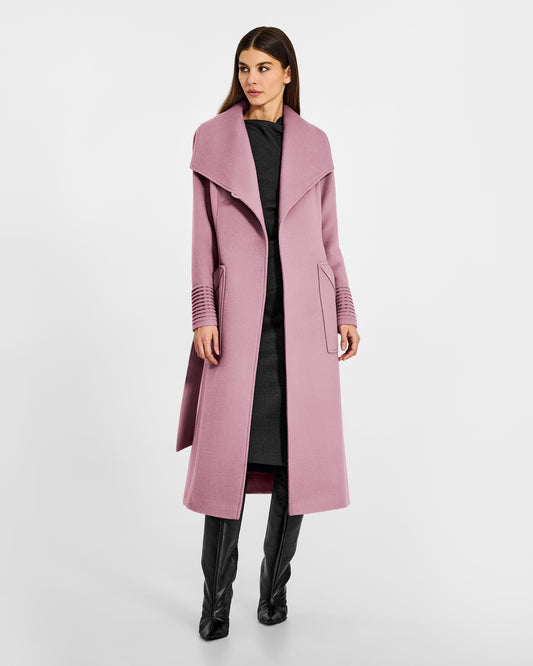 Front view of model wearing a Sentaler peony pink long wrap coat made of baby alpaca wool, with a wide collar, worn open.