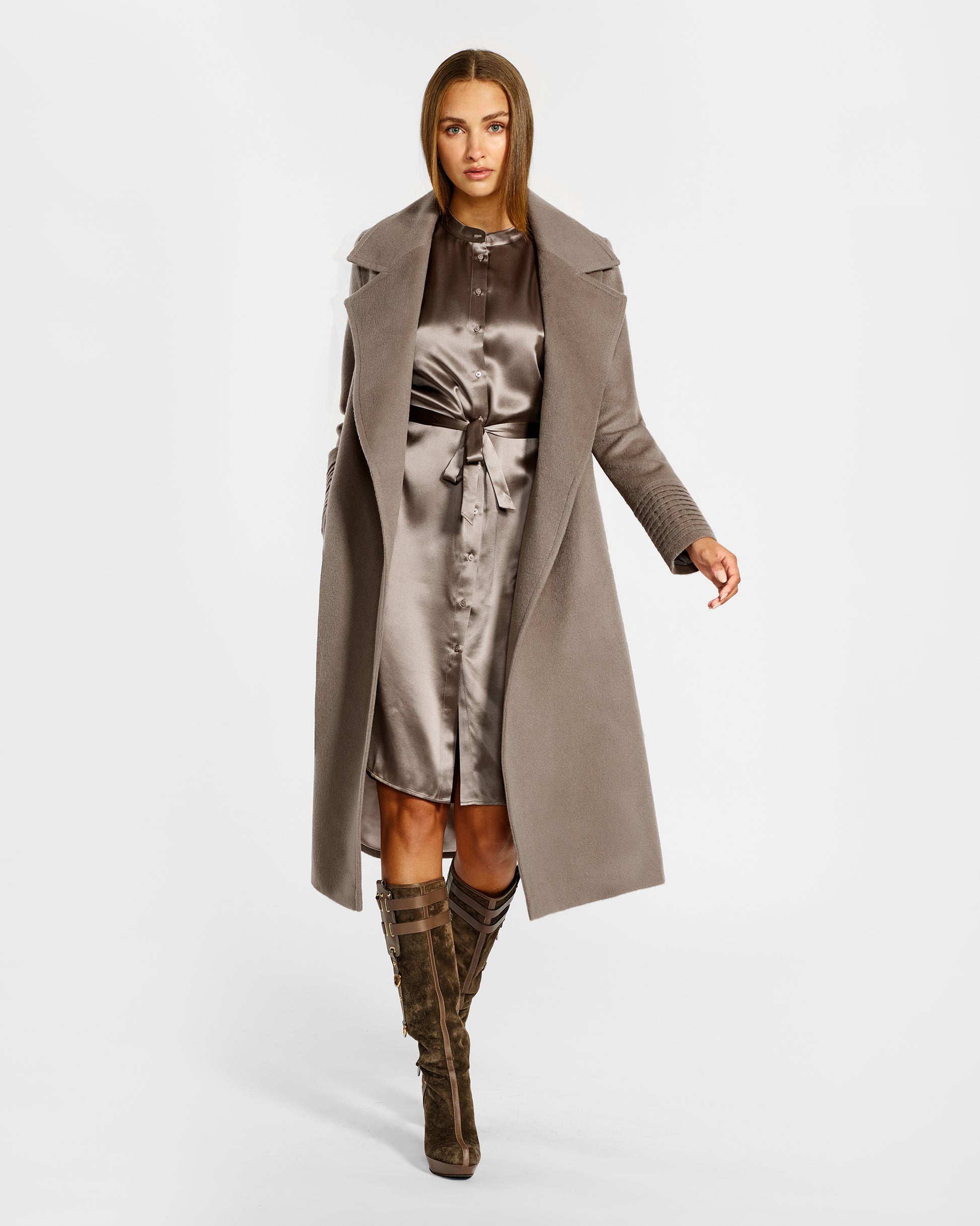 Front view of model wearing a Sentaler warm taupe long coat made of baby alpaca wool, with a wide notched collar, worn open.