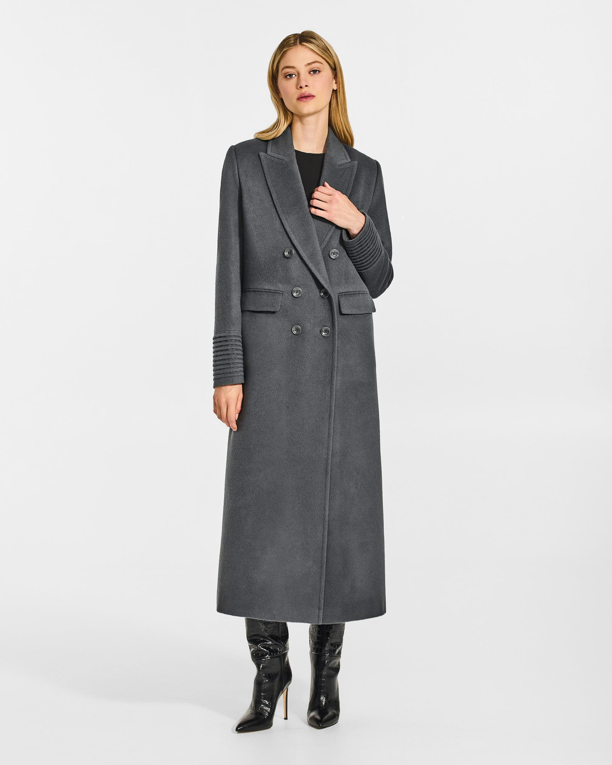 Front view of model wearing a Sentaler graphite grey double breasted maxi coat made of baby alpaca wool, with a peak collar, worn buttoned.