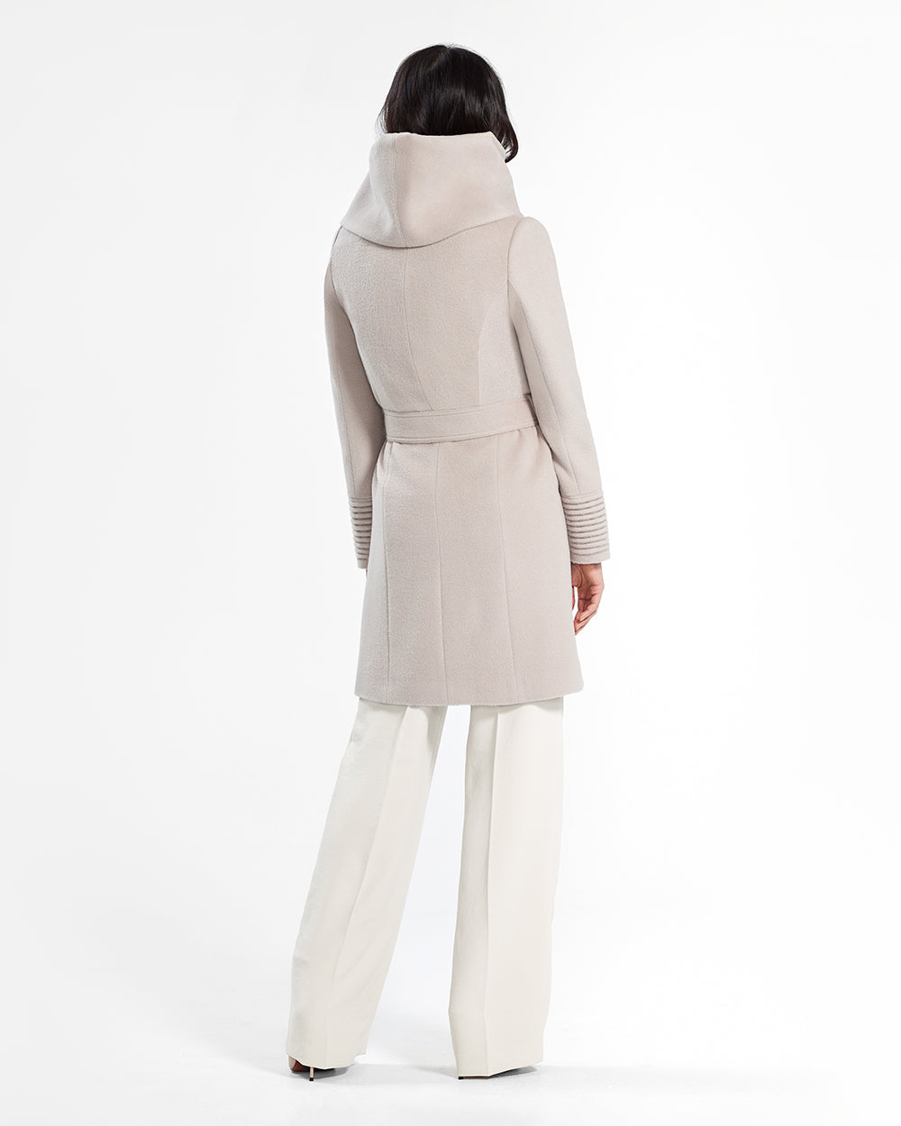 Sentaler Mid Length Hooded Wrap Bleeker Beige Coat in Baby Alpaca wool. Seen from back belted on female model.