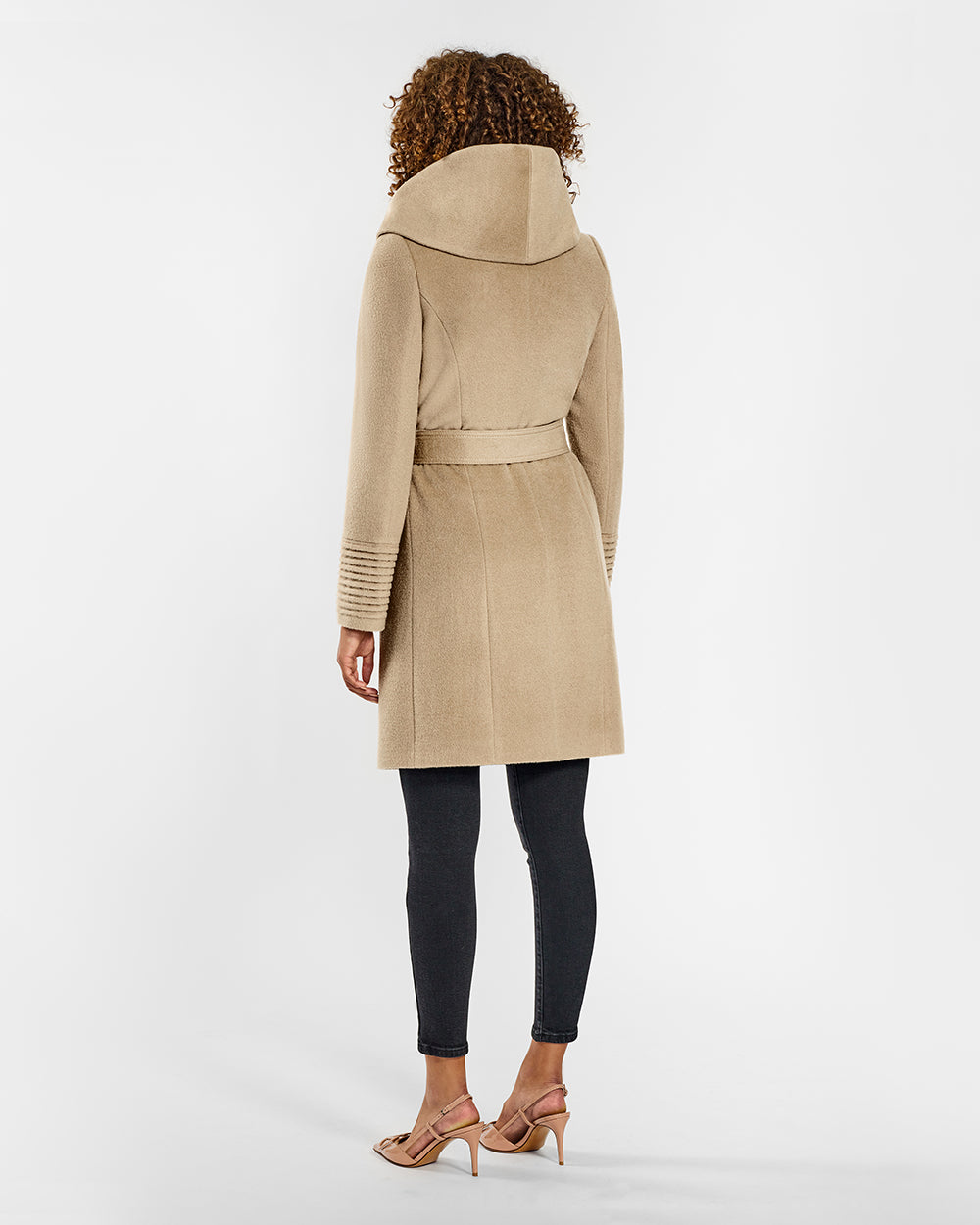 Sentaler Mid Length Hooded Wrap Camel Coat in Baby Alpaca wool. Seen from back belted on female model.