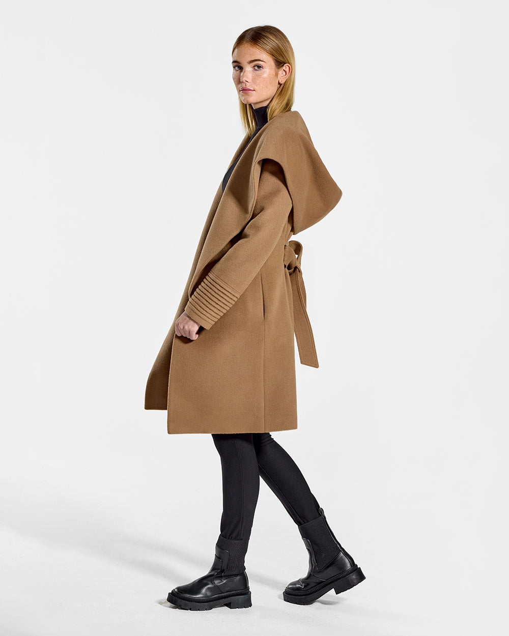 Sentaler Mid Length Hooded Wrap Dark Camel Coat in Baby Alpaca wool. Seen from side open on female model.