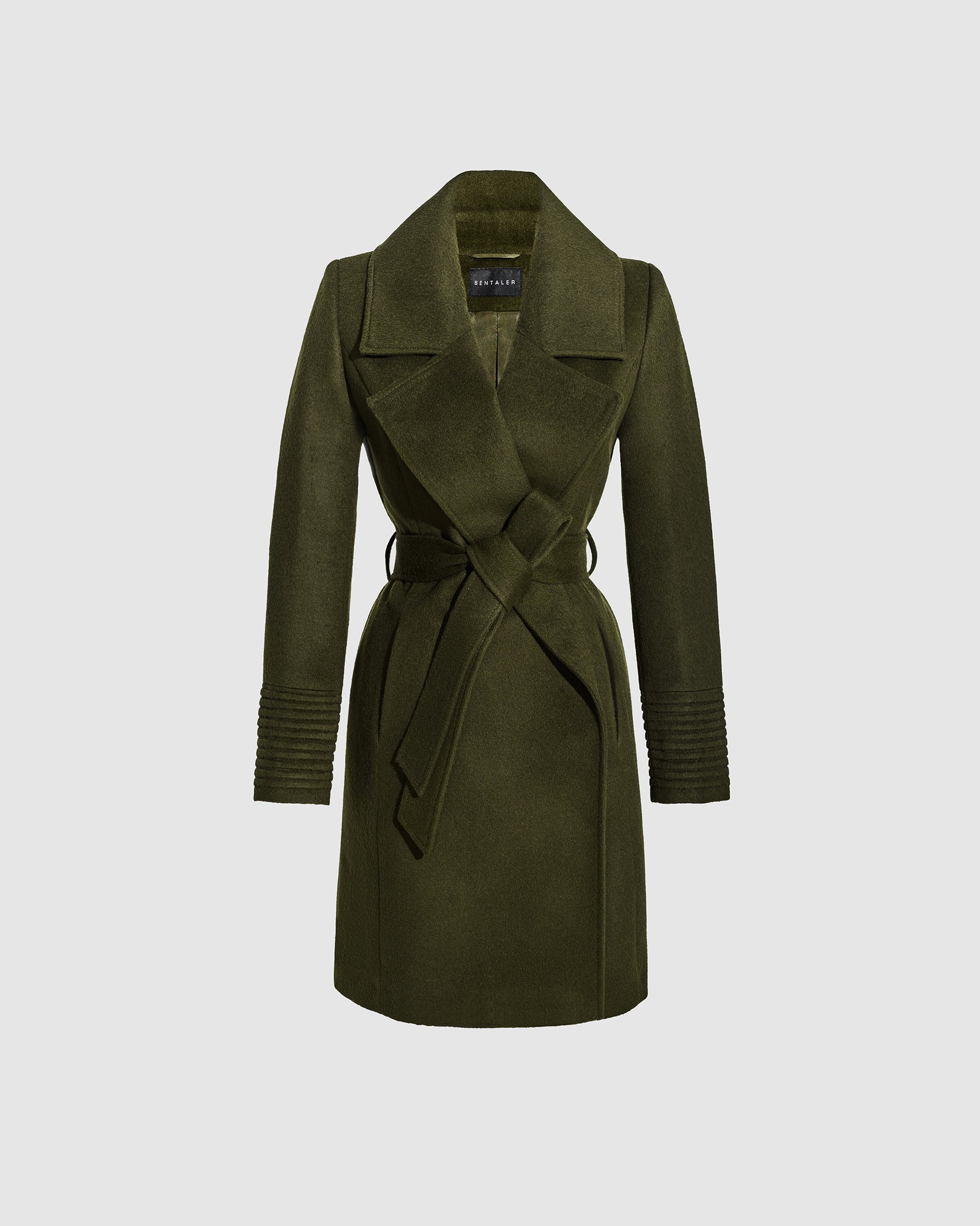 Sentaler mid length olive green coat with large notched collar in baby alpaca wool, shown belted.